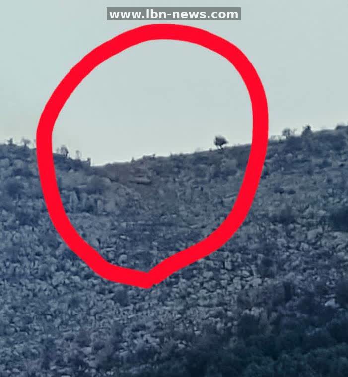 Two Israeli Merkava tanks advance near Kfar Shouba